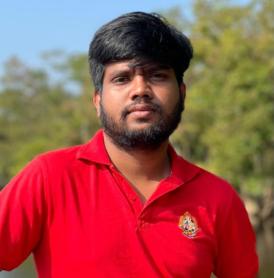 Buddhi Malinda outdoors in a red polo shirt