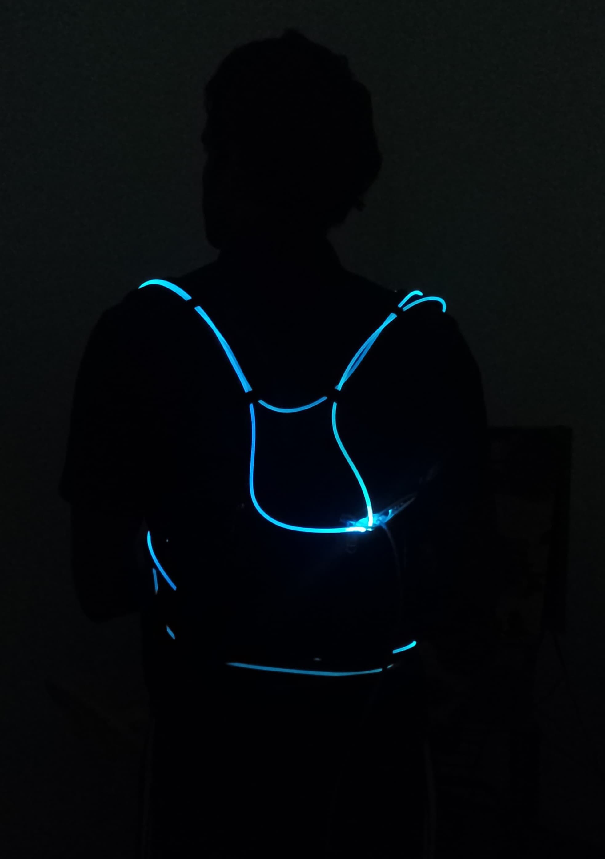 Glowing energy-harvesting safety jacket in the dark